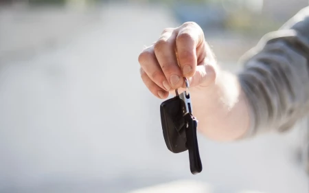 Hand holding a set of car keys